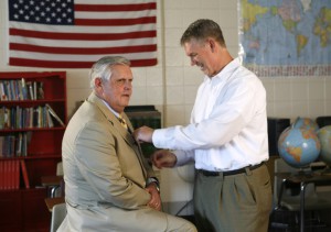 Videographer Clint Goins, right, pins a microphone to Education Commissioner Terry Holliday before filming a welcome back message to students and teachers recently. The video was made at Second Street School (Frankfort Independent). Photo by Amy Wallot, July 7, 2011 Videographer Clint Goins, right, pins a microphone to Education Commissioner Terry Holliday before filming a welcome back message to students and teachers recently. The video was made at Second Street School (Frankfort Independent). Photo by Amy Wallot, July 7, 2011