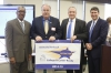 The Floyd County school district was recognized as a District of Distinction for the 2014-15 school year by the Kentucky Board of Education at its February meeting. Pictured at the presentation of the District of Distinction banner are, from left, William Twyman, KBE vice chairman; Jeff Stumbo, Floyd County Board of Education chairman; Henry Webb, Floyd County superintendent; and Stephen Pruitt, Kentucky education commissioner. Photo by Mike Marsee, Feb. 3, 2016