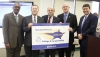 The Russell Independent school district was recognized as a District of Distinction for the 2014-15 school year by the Kentucky Board of Education at its February meeting. Pictured at the presentation of the District of Distinction banner are, from left, William Twyman, KBE vice chairman; Terry West, Russell Independent Board of Education chairman; John Jones, Russell Independent Board of Education member; Sean Horne, Russell Independent superintendent; and Stephen Pruitt, Kentucky education commissioner. Photo by Mike Marsee, Feb. 3, 2016