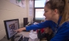 Trinity Brown helps out a group of 7th-graders with their project proposal. Brown, an 8th-grade honor roll student, helps Chaney in his class and is considering becoming a teacher after her experiences in the class. Photo by Bobby Ellis, March 23, 2016