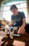 Spencer County Middle School student Will Moon works on his robot during the Lego robotics club. The club is led by a parent volunteer. Photo by Bobby Ellis, March 30, 2016