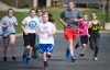 Spencer County Middle School Principal Matt Mercer runs with students during the running club that is part of the school’s Grizzlies Beyond the Bell after-school program. Photo by Bobby Ellis, March 30, 2016
