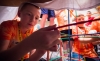 Jackson Wilkerson, of Northern Elementary, builds a tower with his classmates in the makerspace at the STLP championships in Lexington. Photo by Bobby Ellis, April 22, 2016