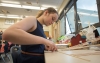 Hannah Sipple cuts a piece of balsa wood for her project. The students have also made presentations, visited colleges and met with female engineers. Photo by Bobby Ellis, April 7, 2016