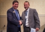 Education Commissioner Stephen Pruitt, from left, congratulates Superintendent Jonathan Jett of the Perry County school district for being named a best practice district. Photo by Bobby Ellis, Sept. 20, 2016