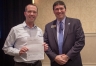 Education Commissioner Stephen Pruitt, from right, congratulates Jay Brewer, president of the board of directors for the Northern Kentucky Cooperative for Educational Services. The cooperative was recognized as a best practice for its regional professional learning communities. Photo by Bobby Ellis, Sept. 20, 2016