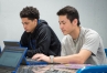 Chris Abscon, left, and Roy Flores, seniors at Adair County High School, work on Spanish homework in the school's new Virtual Learning Academy. Most of the students who use the academy for online learning work on Chromebooks. Photo by Bobby Ellis, Sept. 26, 2016