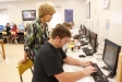 Suzanne McCowan helps Dustin Lewis with his English IV assignment at the McDaniel Learning Center (Laurel County). Students can work at their own pace in the program. Photo by Amy Wallot, Sept. 7, 2012