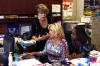 Karen McCuiston, director of the Post-Secondary Education and Resource Center at the Kentucky Center for School Safety, shows North Middle School (Hardin County) Youth Services Coordinator Jodie Bodnar, center, and 8th-grade social studies teacher Te’Andra Parker online resources they can use during Kentucky Safe Schools Week. Photo by Mike Marsee, Sept. 14, 2015