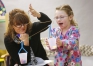Graci Ballard adds small bears to a homemade solve the problem if she or her friends has more bears during Donna Howard's preschool class at Whitesville Elementary School (Daviess County). 
Photo by Amy Wallot, Feb. 5, 2015