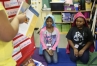 Dasia Stewart and Zahria Morrison-Nettles play the role of immigrants during their skit demonstrating the vocabulary word citizen during Leslie Montgomery\'s 5th-grade class at Atkinson Academy (Jefferson County).Photo by Amy Wallot, Feb. 5, 2013