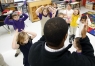 Lederrick Wesley leads 1st-grade students to put their hands on their heads during his  music class at Bardstown Primary School (Bardstown Ind.). Photo by Amy Wallot, Jan. 23, 2013