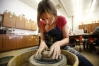Junior Samantha Ruedebasch works clay on a potter’s wheel during Monica Namyar\'s art class at Beechwood High School (Beechwood Independent). She is considering a career in fashion or design. Photo by Amy Wallot, Feb. 19, 2014 