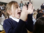Kindergarten student Stella Gootee applauds her principal being named the Milken Family Foundation National Educator Award winner. Photo by Amy Wallot, Jan. 15, 2015