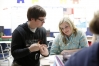Murray State University student teacher Zack Traylor helps 8th-grade student Karlee Doran chart points on a plane during Valerie Waller\'s class at Calloway County Middle School. Photo by Amy Wallot, April 25, 2013