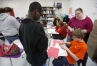 Murray State University student teacher Amanda Pickler helps 8th-grade students Kenneth Jackson and Trevor Turner with an activity using angles during Heather Scott\'s class at Calloway County Middle School. Photo by Amy Wallot, April 25, 2013