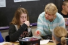 Faye Smith helps Cedar Schneider with quadratic equations. Photo by Amy Wallot, April 17, 2015