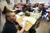 Noah Wirth listens as Faye Smith teaches about quadratic equations.  Photo by Amy Wallot, April 17, 2015