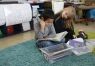 Matthew Johnson and Taylor Corum read together in Katy Paas\' 1st grade class at Campbellsburg Elementary School (Henry County). Behind them is a poster the class created that asks, 