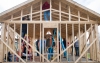 Garlen Whitis' students work in the rafters of the tiny house his Casey County class is building. The students researched the tiny house craze before designing the house. Photo by Bobby Ellis, Feb. 3, 2017