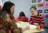 Special Education teacher Crystal Fires helps Harli Hanisch and Cevin Prater with an assignment on measuring volume at Central Elementary School (Marshall County).Photo by Amy Wallot, April 21, 2015