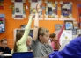 Fourth-grade student John Turner raises his hand to answer a question about relative pronouns during class at Central Elementary School (Marshall County).Photo by Amy Wallot, April 21, 2015