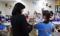 Sharon Graves uses 8th-grade student Caitlyn Ward\'s arm to demonstrate how doctors would amputate arms and legs during the Civil War to her American History class at Clark-Moores Middle School (Madison County). Photo by Amy Wallot, Oct. 15, 2012