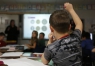Ryan Hazelwood answers a question about Chinese currency during Crystal Harris' 2nd-grade class at Clay Elementary School (Webster County). Photo by Amy Wallot, Jan. 28, 2015