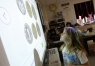 Second-grade student Peyton Campbell look at pictures of Chinese currency, yuan, at Clay Elementary School (Webster County). Photo by Amy Wallot, Jan. 28, 2015