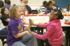 Third-grade students Natalie Evans, left, and Nariah Williams play a hand clapping game during lunch at Cline Elementary School (Campbell County), a Blue Ribbon School, Nov. 10, 2010. Photo by Amy Wallot