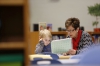 Brenda Folley helps 1st-grade student Aayden King with math skills in the library. The library has plenty of space to work with students one-on-one or in small or large groups.  Photo by Amy Wallot, Dec. 2, 2014
