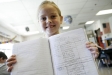 Fourth-grade student Lauren Riley displays her notebook with her osprey observations during Andrea Parson\'s 4th-grade class  at Cumberland County Elementary School. Photo by Amy Wallot, April 11, 2012
