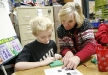 Third-grade student Wesley Hobbs works with teacher Kathy Newcomb in a small group using mathematics manipulatives at Dixie Elementary Magnet School (Fayette County) Jan. 6, 2011. Photo by Amy Wallot