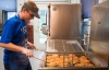 Taylor Brown, a junior at Metcalfe County High School, fries cinnamon rolls to be sold at the Old School Café. Photo by Bobby Ellis, May 24, 2017