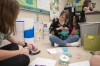 Kayleigh Cook works on a mathematics project in which she adds weight to plastic eggs and studies its effect in the Academy at the Creek. Photo by Bobby Ellis, April 25, 2018