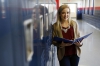 Junior Margaret Collins stands with her data notebook at East Carter High School (Carter County). Her notebook contains information about her testing results, benchmark scores and assignment information. Principal Larry Kiser said the students "own their own data."Photo by Amy Wallot, Dec. 12, 2014