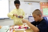 Mustfa Malik and Chase Smith work together building their design of an animal that could transfer a lot of pollen during Debbie Lewis\' 2nd-grade class at Morningside Elementary School (Elizabethtown Independent). Photo by Amy Wallot,  May 19, 2014