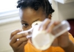 Fifth-grade student Savella Rankins demonstrates a microscope she built in Rebecca Logan's STEM class at Elkhorn Elementary School (Franklin County). Photo by Amy Wallot, Nov. 9, 2011