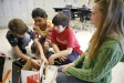 Justin Suter, Sasha Sairajeev, Kienan Ramlee and Kaitlyn Carmack work together building a Mars rover that will compete to scoop up ping pong balls during Rebecca Logan's 5th-grade STEM class at Elkhorn Elementary School (Franklin County). Photo by Amy Wallot, Nov, 9, 2011
