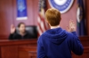 Law teacher Michael Tackett swears in members of the jury to serve on the trial of Brutus for the murder of Julius Caesar in the Law and Justice Village at Elkhorn Crossing School (Scott County).  Photo by Amy Wallot, March 20, 2015​