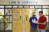 History teacher Andrew Burgoon reviews notes with freshman Desani Lewis at Elkhorn Crossing School (Scott County). Photo by Amy Wallot, March 20, 2015