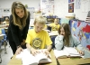 Fifth-grade teacher Amy Hampton helps Deven Soward and Hanna Morris with a spelling and vocabulary assignment at Ezel Elementary School (Morgan County) Oct. 25, 2010.  Photo by Amy Wallot