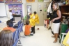 Fifth-grade student Nicolas Franchi gets dressed as a fisherman during an activity in Christina Cornelius class that ended with the whole class dressed as a profession at James E. Farmer Elementary School (Jefferson County). Photo by Amy Wallot, Aug. 27, 2013