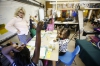 Sarah Reed reviews numerators and denominators with a small group during her 3rd-grade class. Photo by Amy Wallot, Nov. 21, 2014