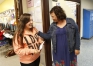 Stephanie Cornwell, the transition facilitator at Franklin-Simpson High School (Simpson County), hands junior Savannah Pitt an Attack the Mission card for doing well in her classes. Photo by Amy Wallot, May 15, 2014
