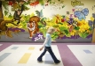 A student walks by a mural featuring a tiger, the school\'s mascot, by Kentucky artist Lori James at Gamaliel Elementary School (Monroe County). Photo by Amy Wallot, Feb. 2, 2012