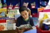 Caleb Trejo "reads for pleasure",  as his teacher Nicole Freyburger calls it, before class gets underway at Glenn O. Swing Elementary School (Covington Independent). Photo by Amy Wallot, May 7, 2015