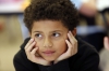 Fifth-grade student Maxwell Jaggers listens to DuPont Manual High School (Jefferson County) students give a lesson about the periodic table in Spanish. Photo by Amy Wallot Nov. 19, 2014