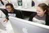 Seventh-grade students Kaleigh Parker and Mackezie Chander explore health science careers while working on career options in their ILPs.  Photo by Amy Wallot, March 10, 2015
