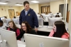 Technology instructor Jeff Clair helps 7th-grade students Angel Gay, Tori Smith and Hailey Stamper with their individual learning plans at Hazard Middle School (Hazard Independent). Photo by Amy Wallot, March 10, 2015
